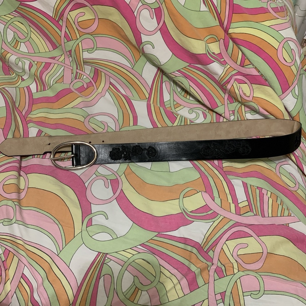 Black faux leather belt with floral details